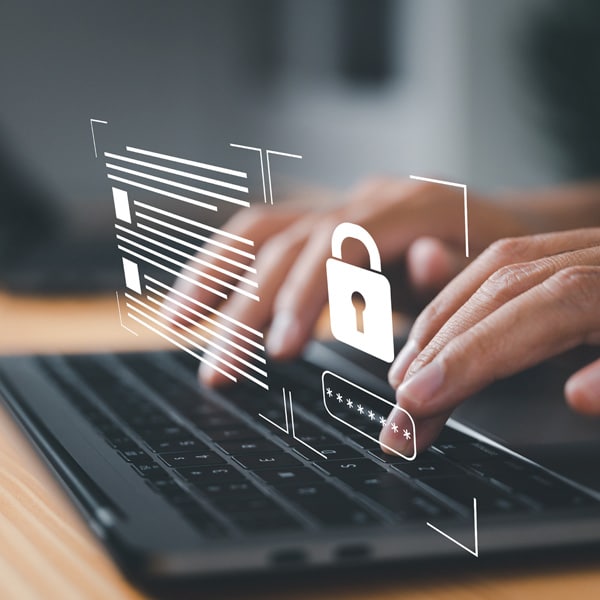 Picture of a hand typing on a keyboard with a padlock overlay