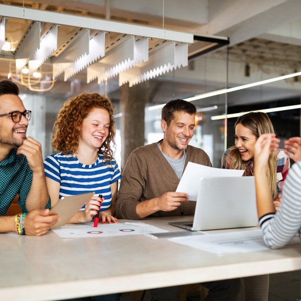 Group of people at a conference table.