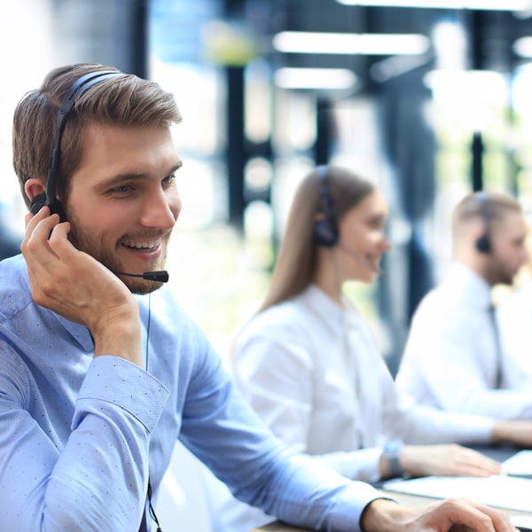 Picture of people in a call center talking about Remote and Onsite Support.