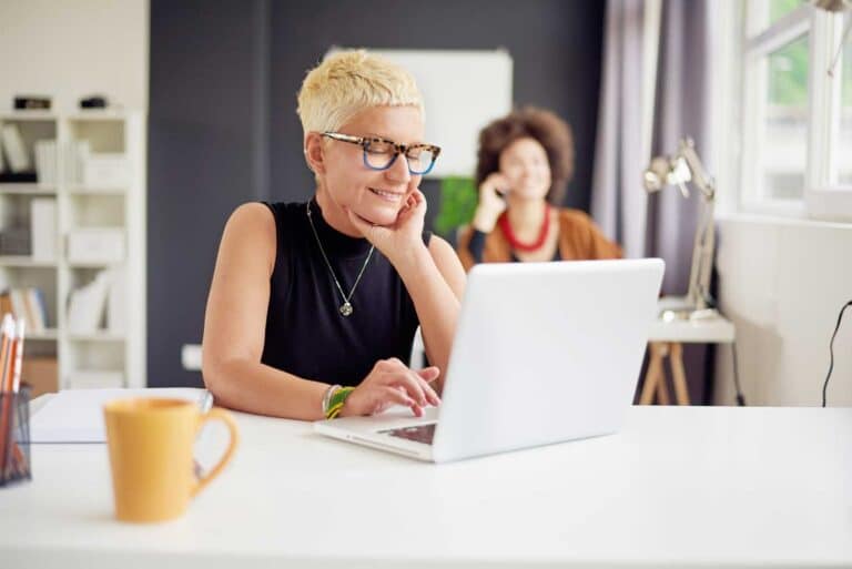 Nonprofit woman looking at IT computer