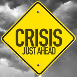 Warning sign that says crisis just ahead
