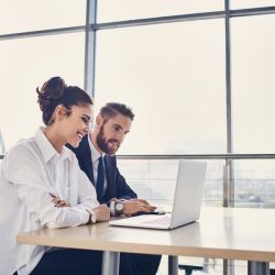 Man and woman - Denver IT support on computer